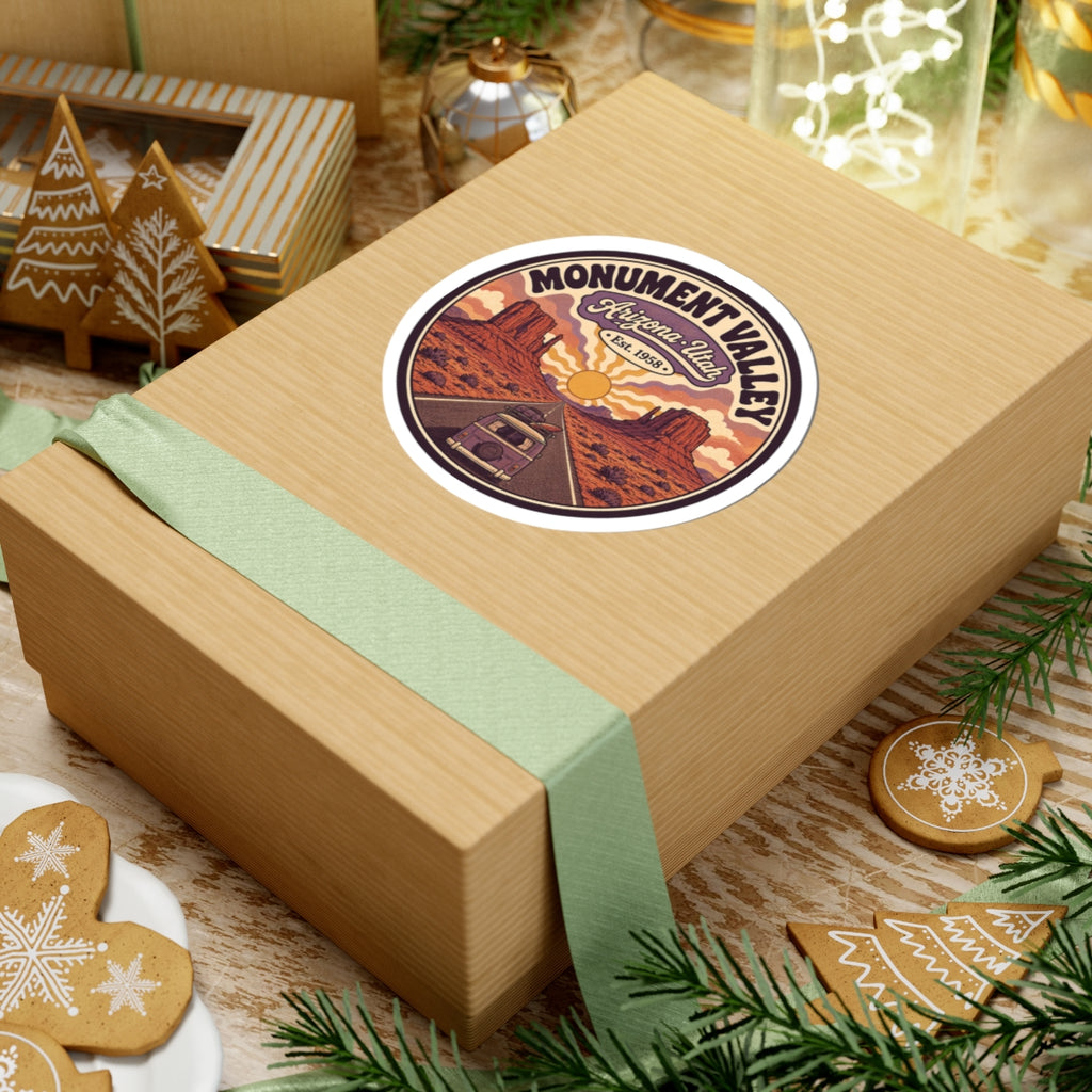 Round vintage Monument Valley sticker on gift box lid with desert mesas and sun road scene
