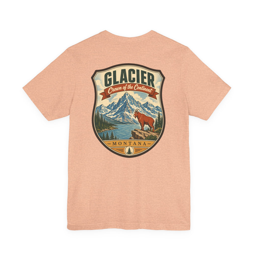 Heather peach crewneck t-shirt with large Glacier Montana mountain bear emblem