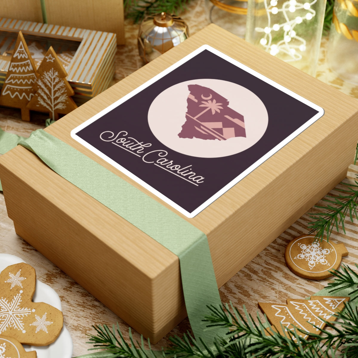 South Carolina sticker on a gift box with beige circle and palm tree silhouette