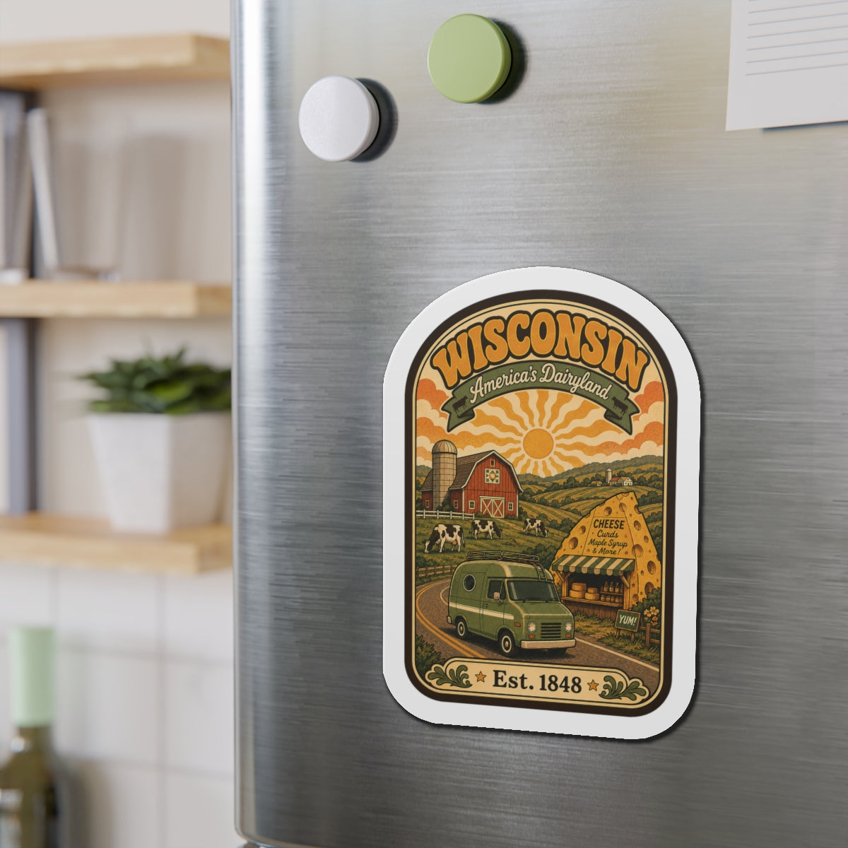 Rounded die-cut Wisconsin Dairyland magnet on brushed stainless fridge door