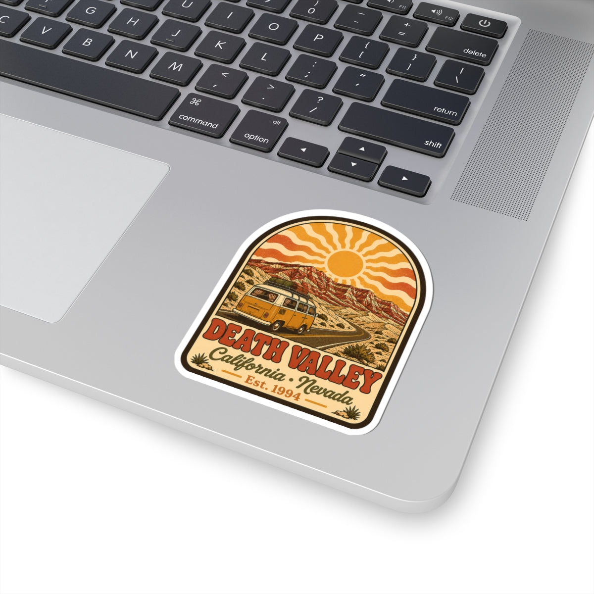 Kiss-cut sticker with retro Death Valley scene: yellow camper van and desert sun