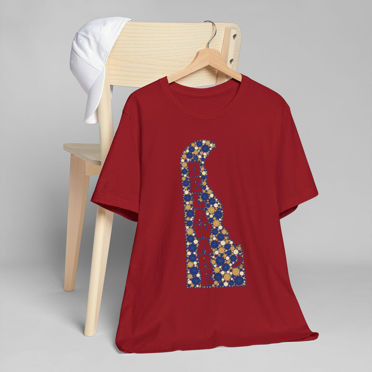 Burgundy crew-neck t-shirt with tall blue-and-gold Delaware map graphic letter.