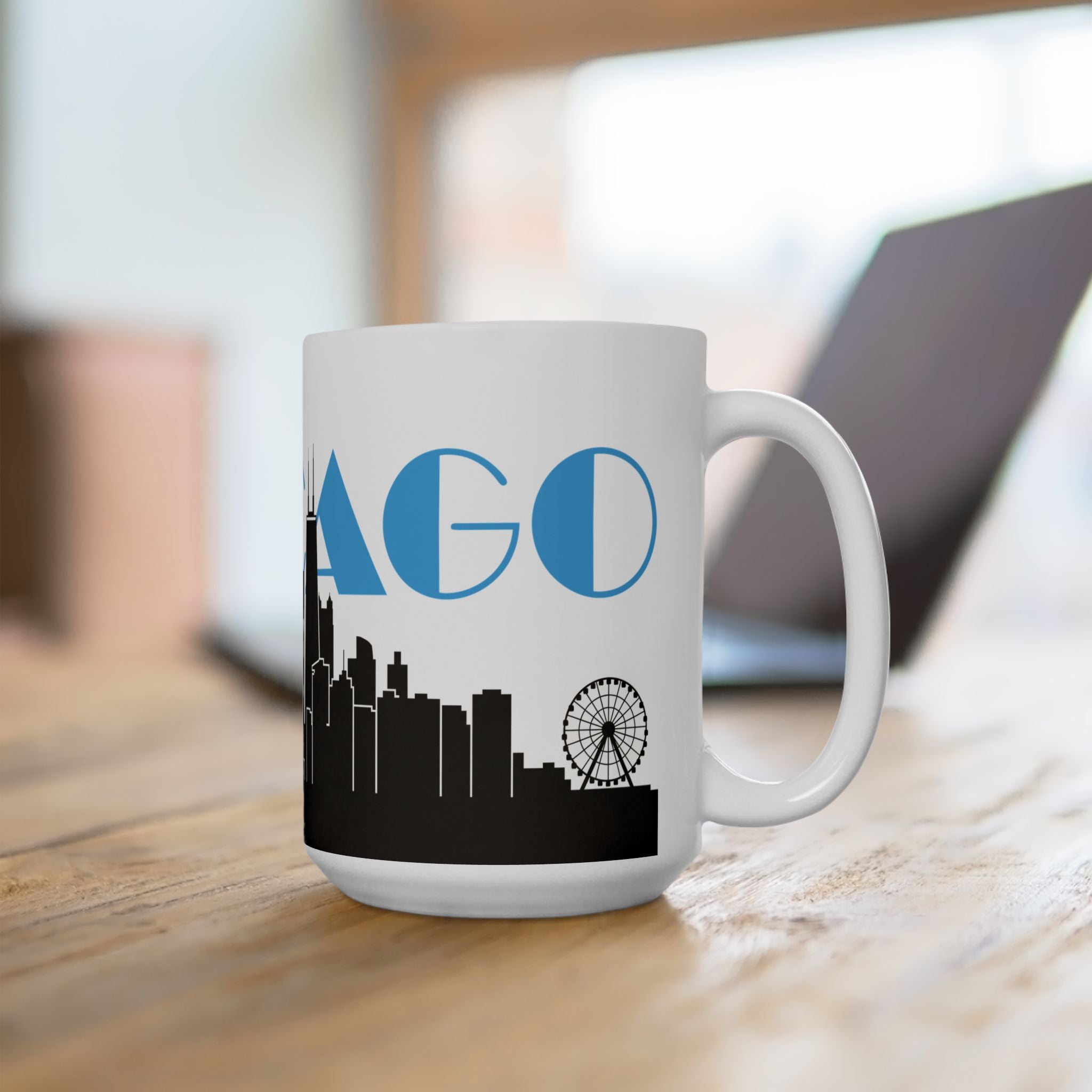 White ceramic mug with handle, blue 'AGO' and black skyline with ferris wheel