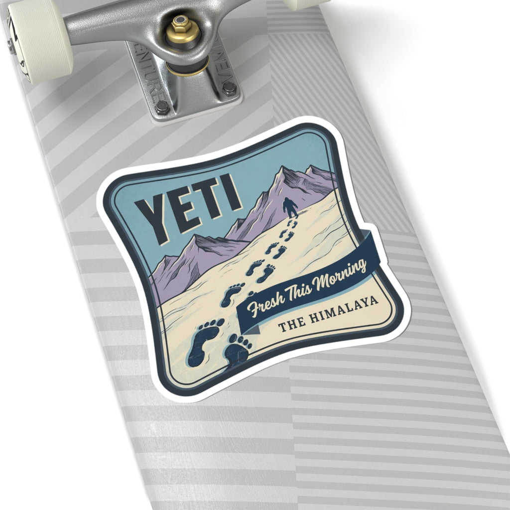 Vinyl decal sticker with YETI, mountain scenery, paw prints, and “Fresh This Morning” text