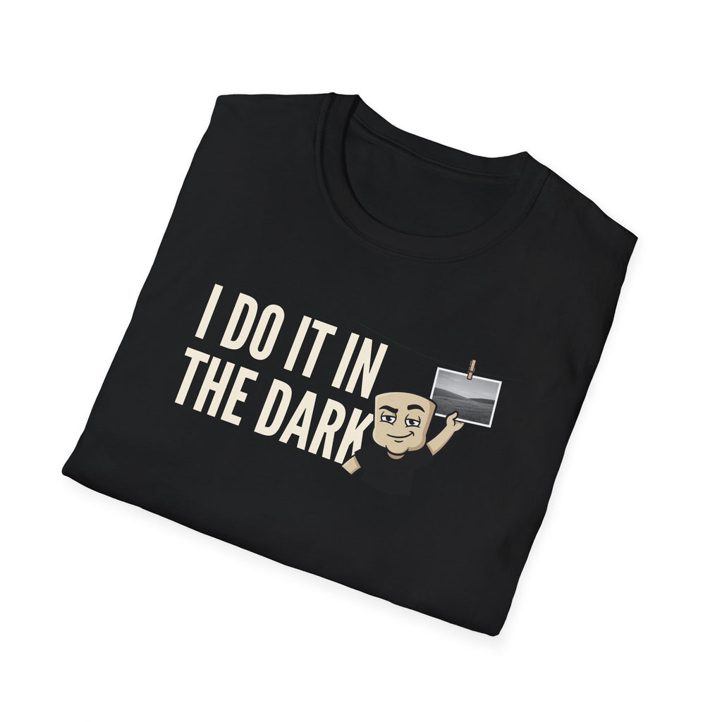 Black T-shirt with "I DO IT IN THE DARK" graphic and cartoon photographer