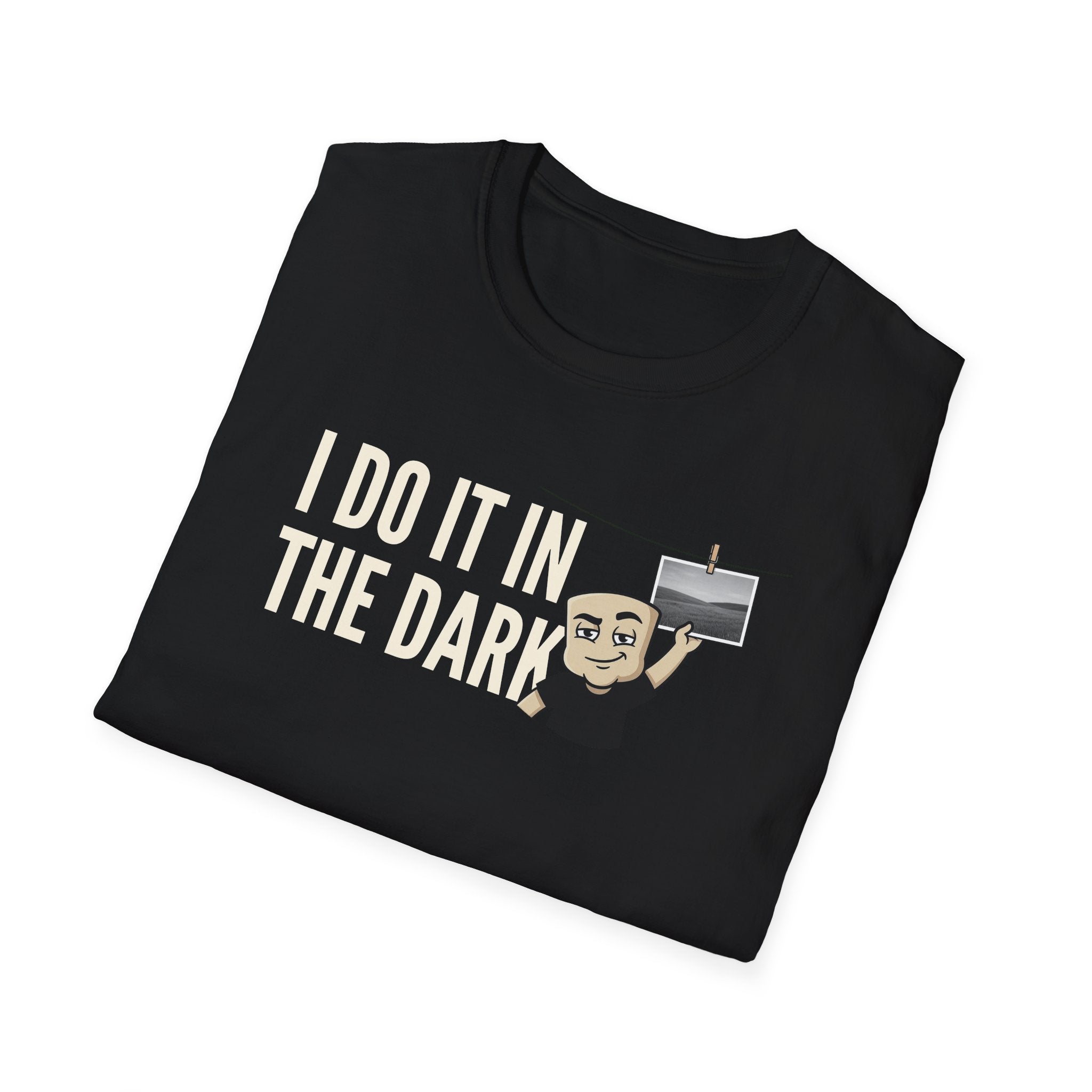 Black T-shirt with "I DO IT IN THE DARK" graphic and cartoon photographer