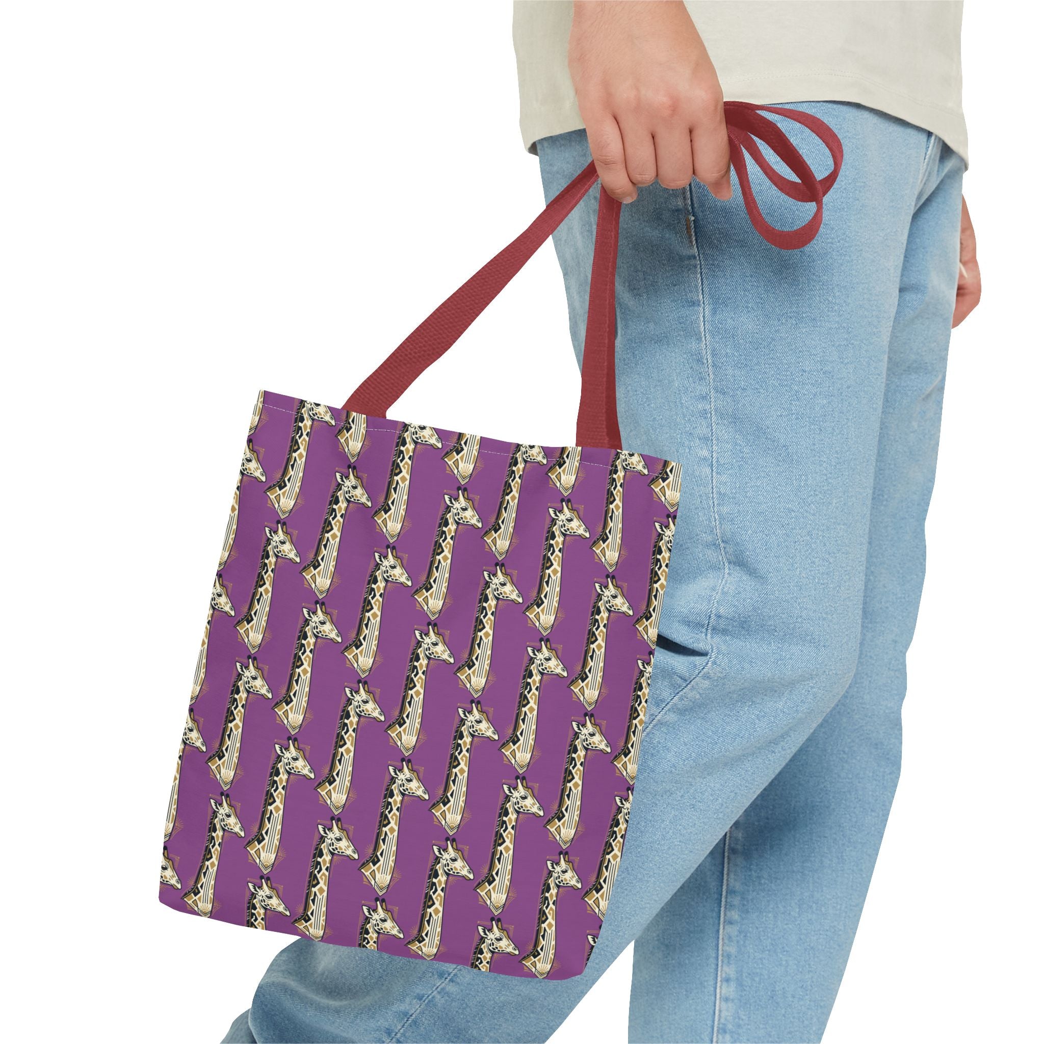Purple tote bag with saxophone pattern, red handles, held by person.