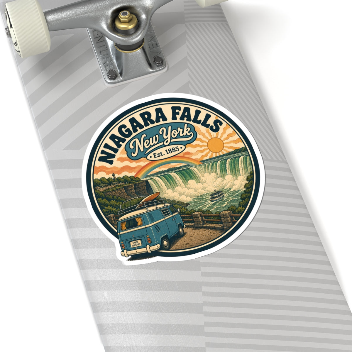 Round white kiss-cut sticker on skateboard with Niagara Falls New York vintage camper van art