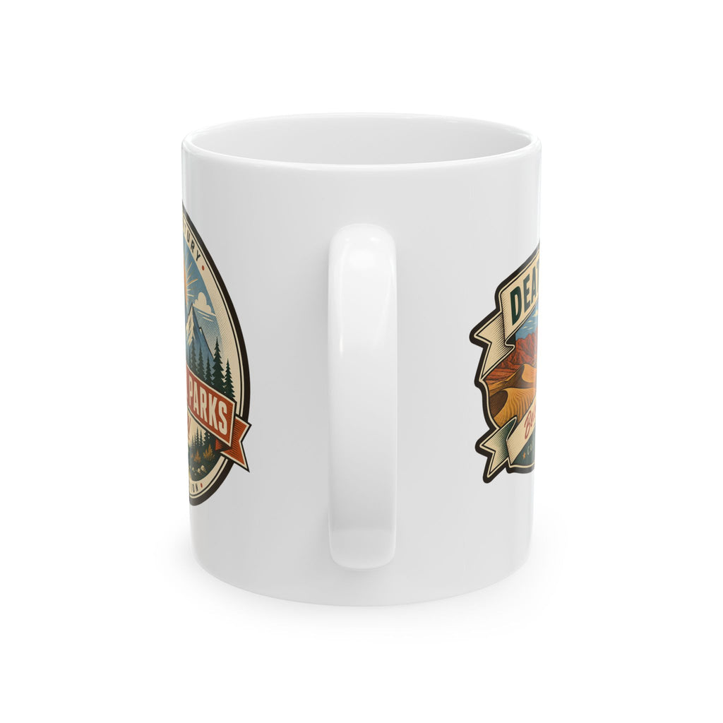 White ceramic mug with vertical handle and partial Death Valley logo print