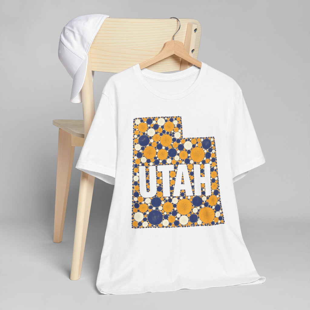 White short-sleeve T-shirt with “UTAH” polka dot map graphic in blue and gold