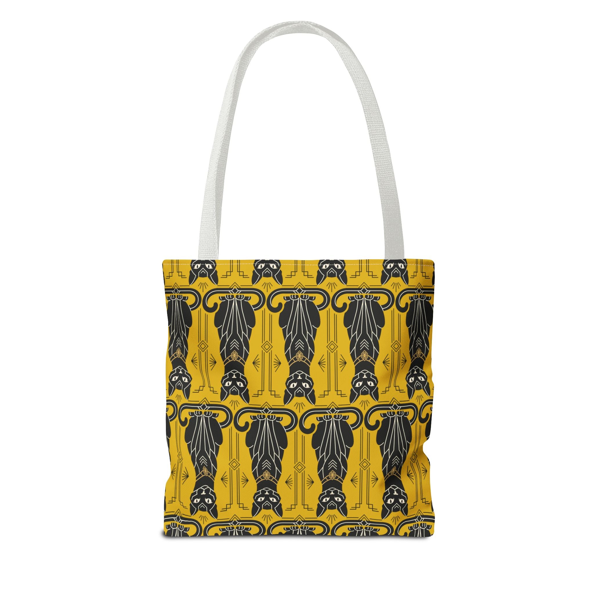 Yellow tote bag with repeating black cat pattern and navy swirls, white handles.