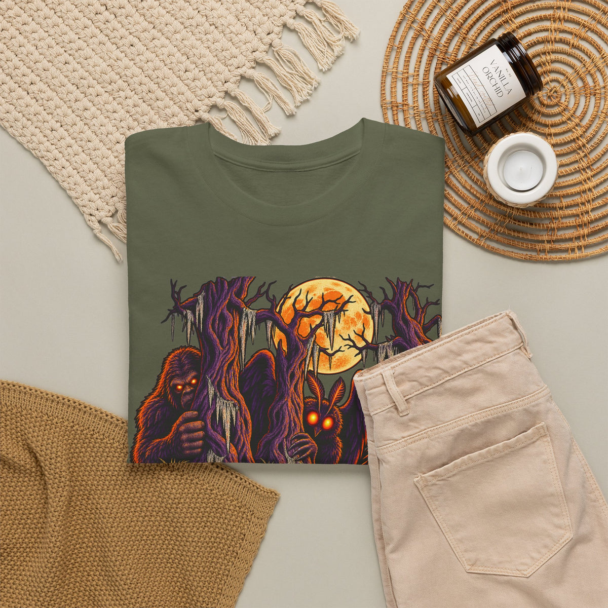 Dark olive green T-shirt featuring haunted monster and moon graphic, crew neck.