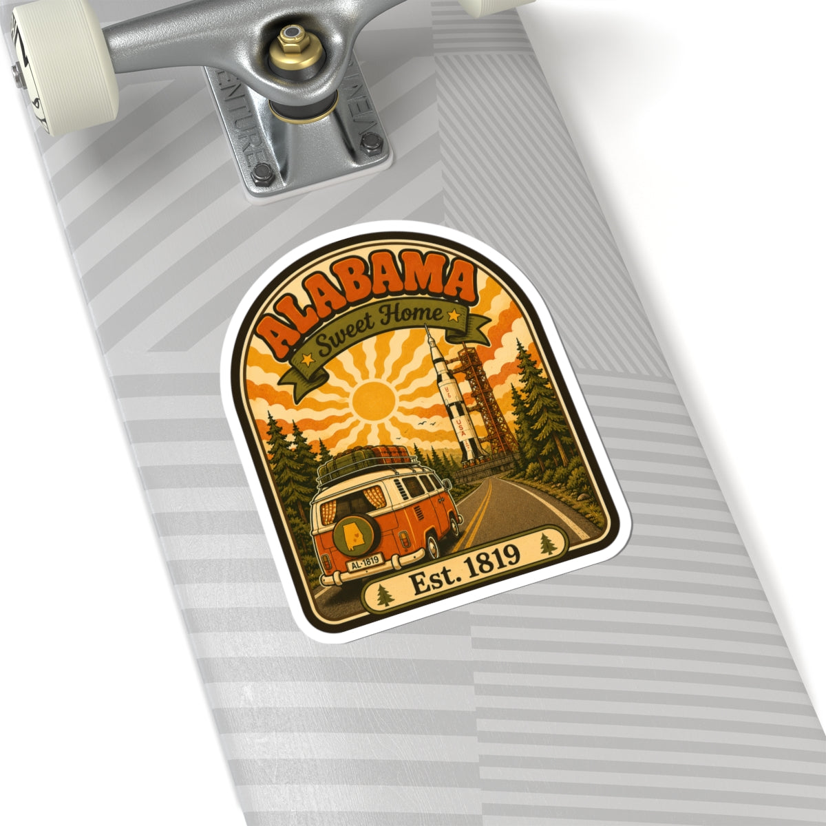Die-cut arched Alabama sticker with orange camper van, tall tower, and Est. 1819.
