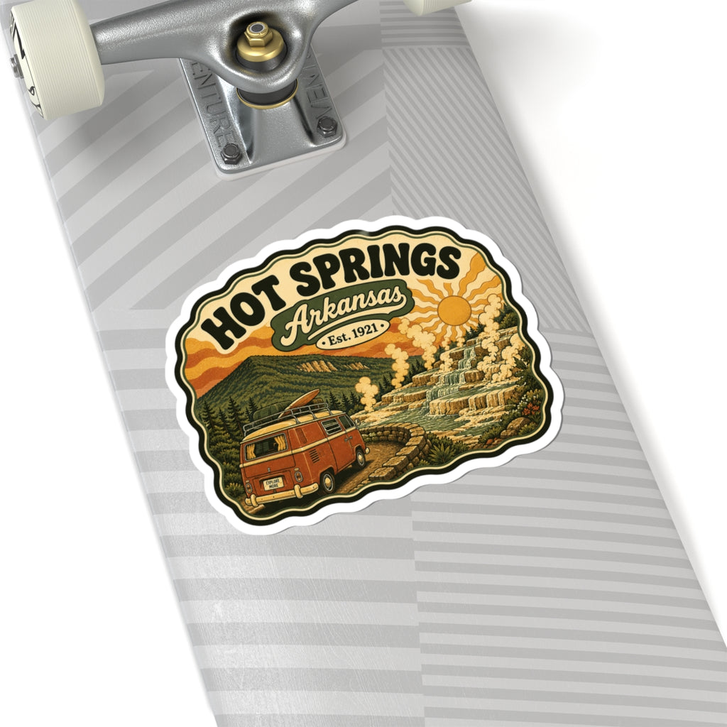 Die-cut Hot Springs Arkansas sticker on striped surface featuring vintage camper van and terraced springs