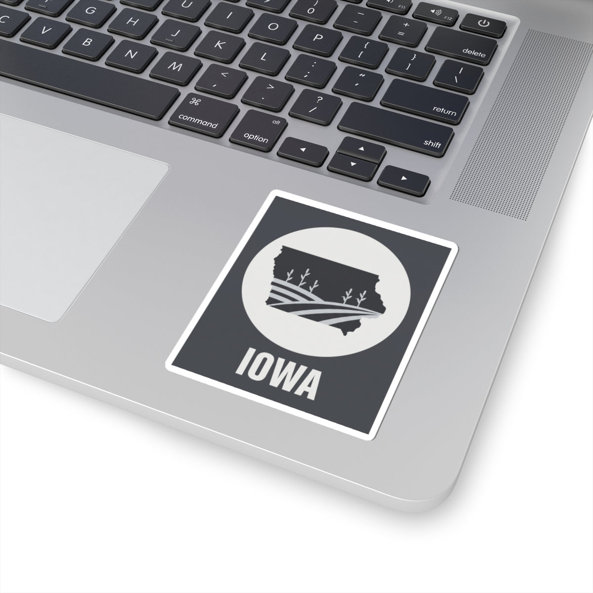 Iowa farmland graphic kiss-cut sticker with black background, white circle emblem, and “IOWA”
