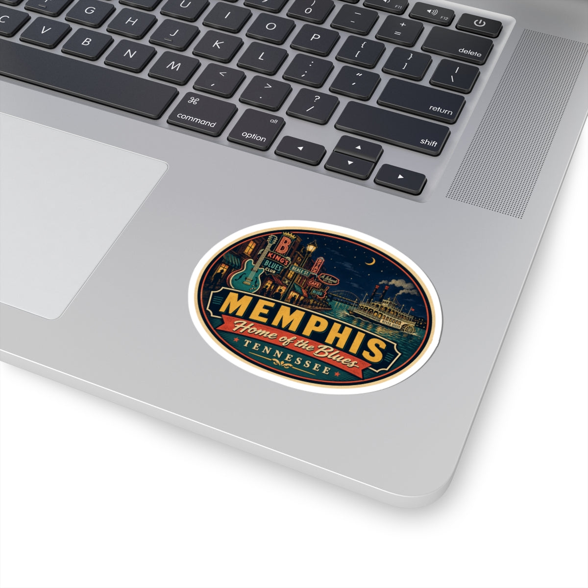 Round Memphis “Home of the Blues” Tennessee luggage tag sticker on a laptop
