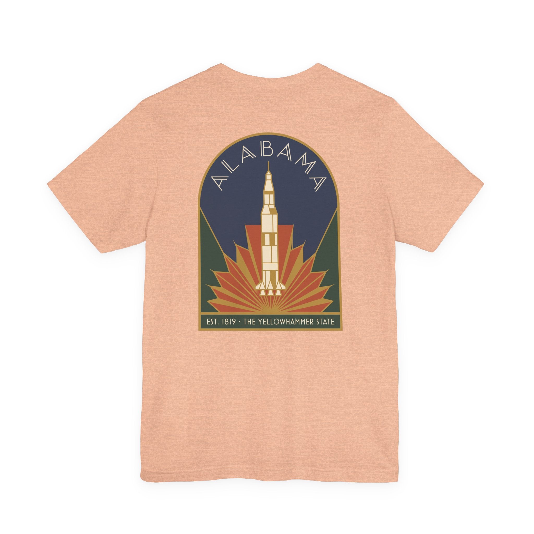Peach T-shirt with Alabama rocket emblem graphic centered on back