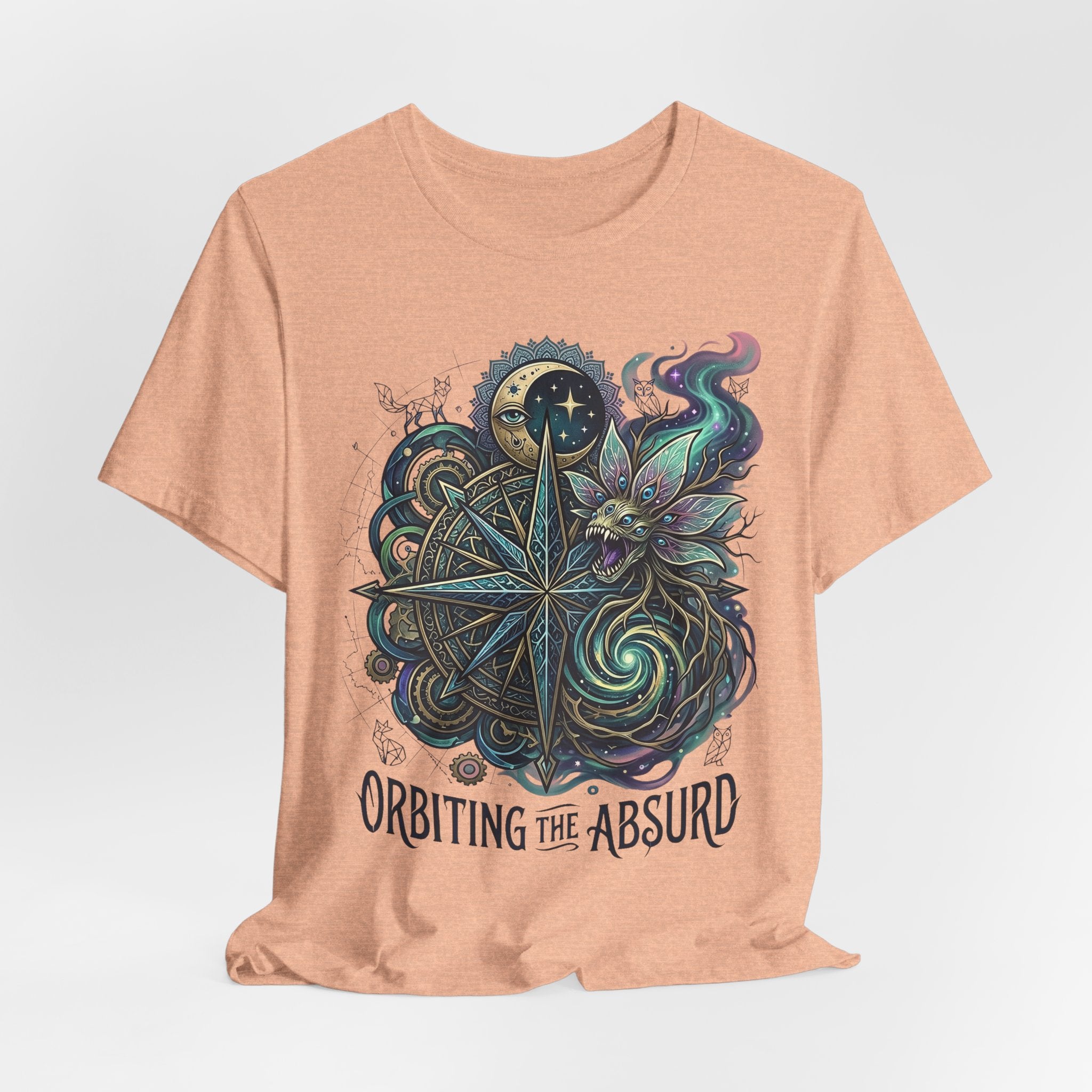 Heather peach celestial compass cat T-shirt with 'ORBITTING THE ABSURD' lettering