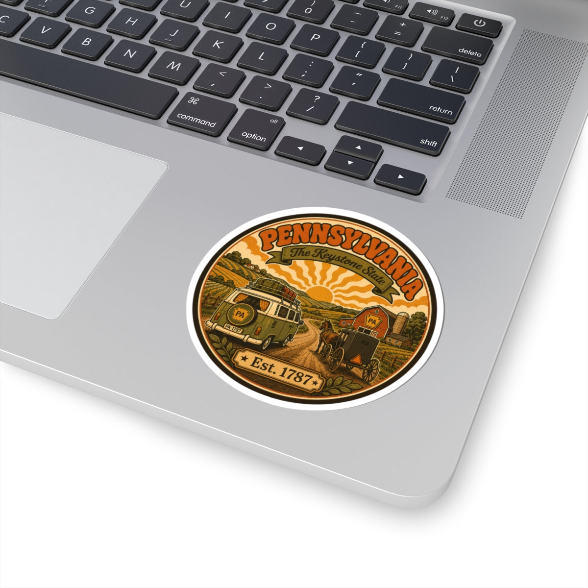 Oval Pennsylvania sticker on a laptop with vintage van, buggy scene, and Est. 1787