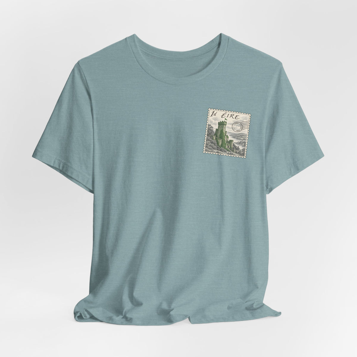 Teal crewneck t-shirt with small vintage postage stamp graphic on chest