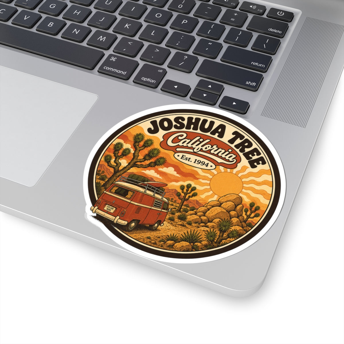Round sticker with white border, Joshua Tree California Est. 1994, desert cacti and van
