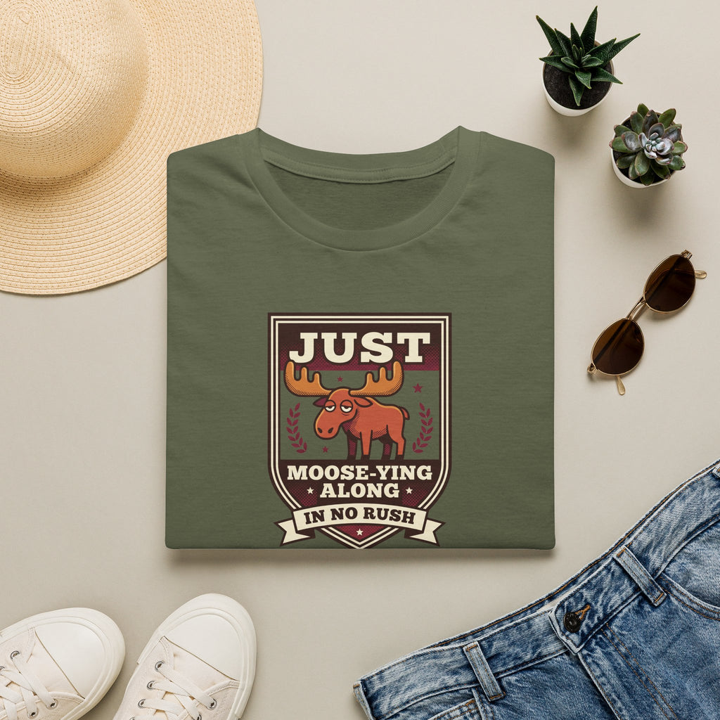 Olive green crewneck T-shirt with “Just Moose-ying Along” moose graphic on chest
