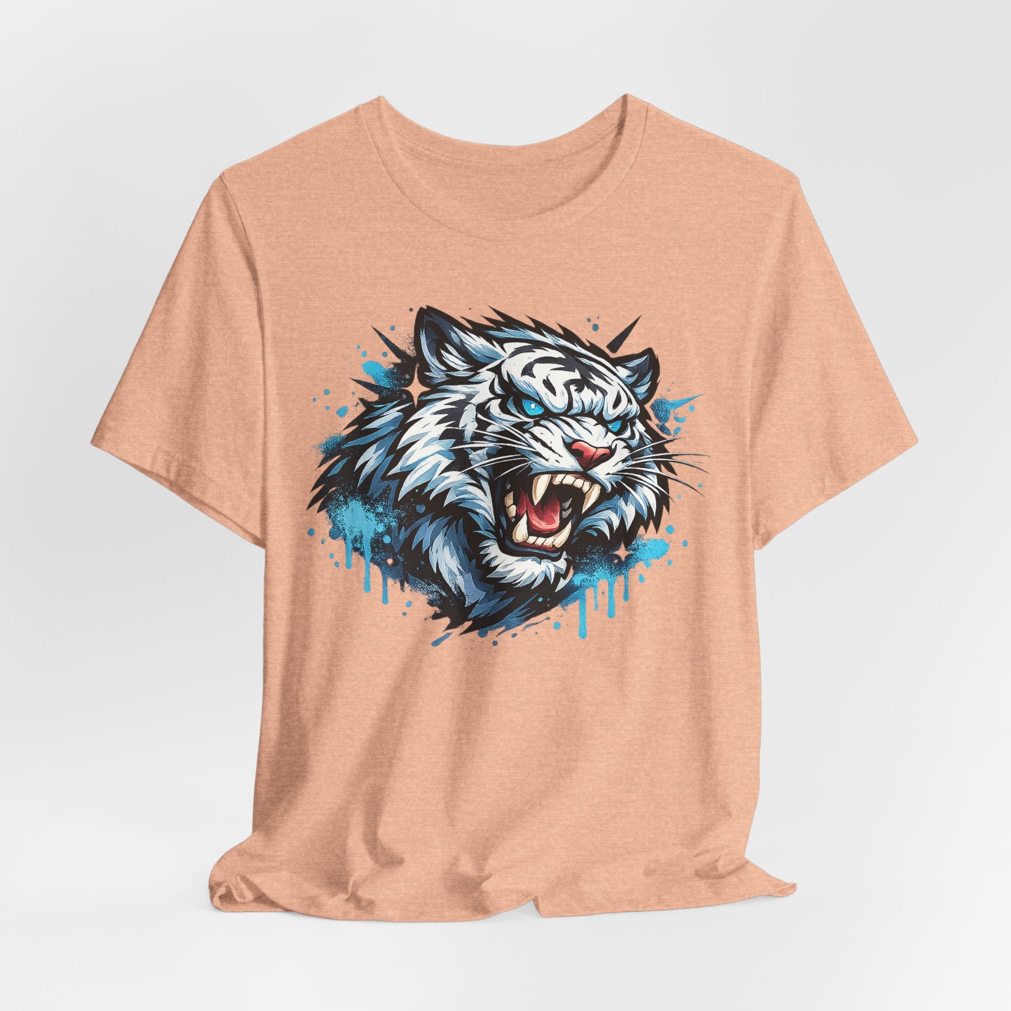 Heather peach t-shirt showing a roaring tiger face graphic with blue splatter drip