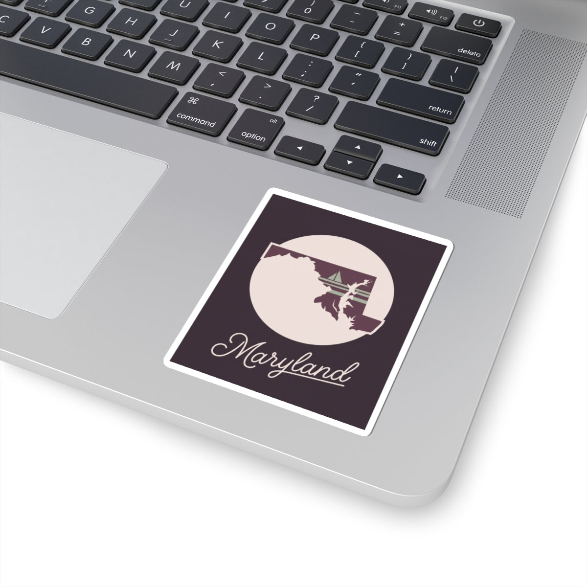 Maryland state silhouette vinyl sticker with circular badge and “Maryland” script, white outline