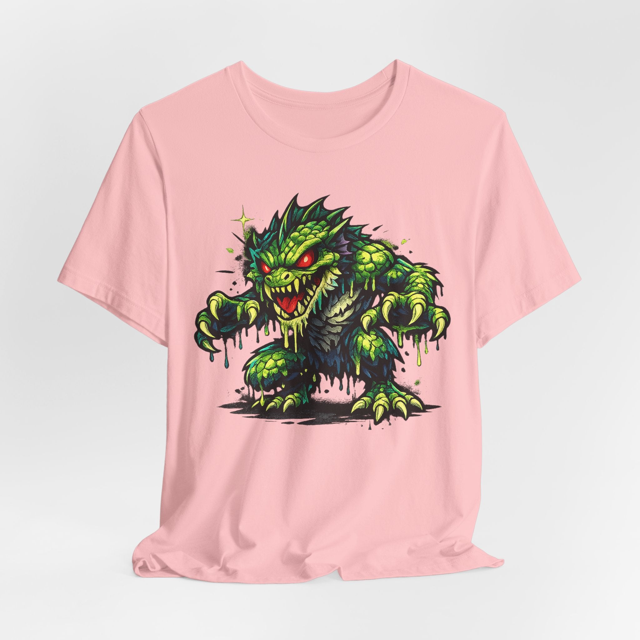 Pink T-shirt featuring a green monster cartoon with dripping slime