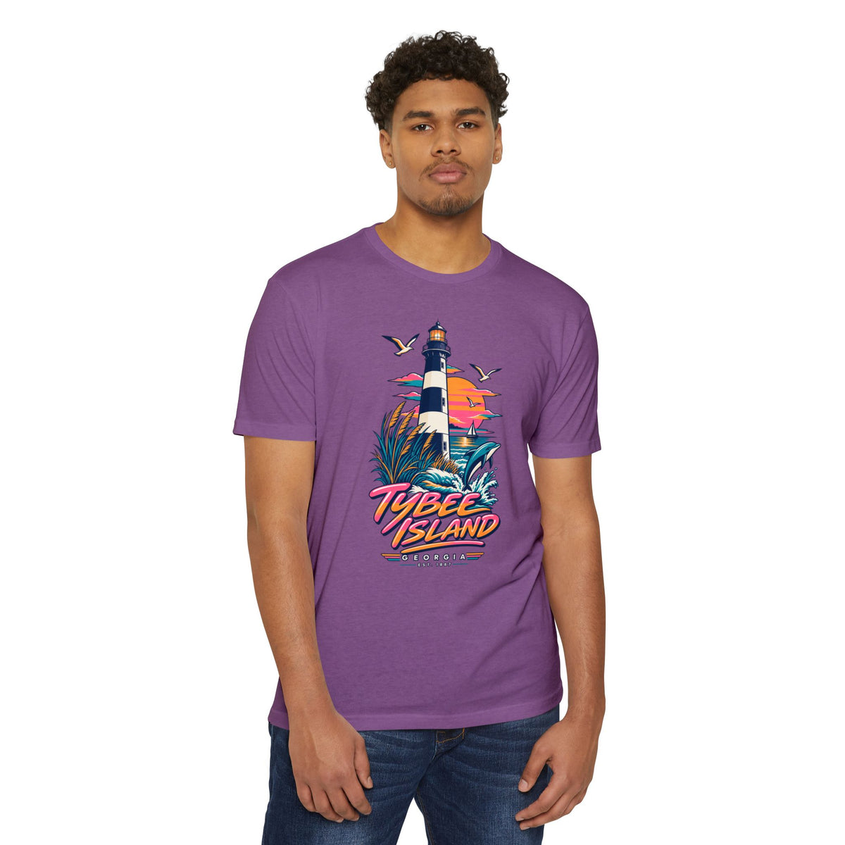 Purple crew-neck T-shirt with colorful lighthouse and island graphic on front