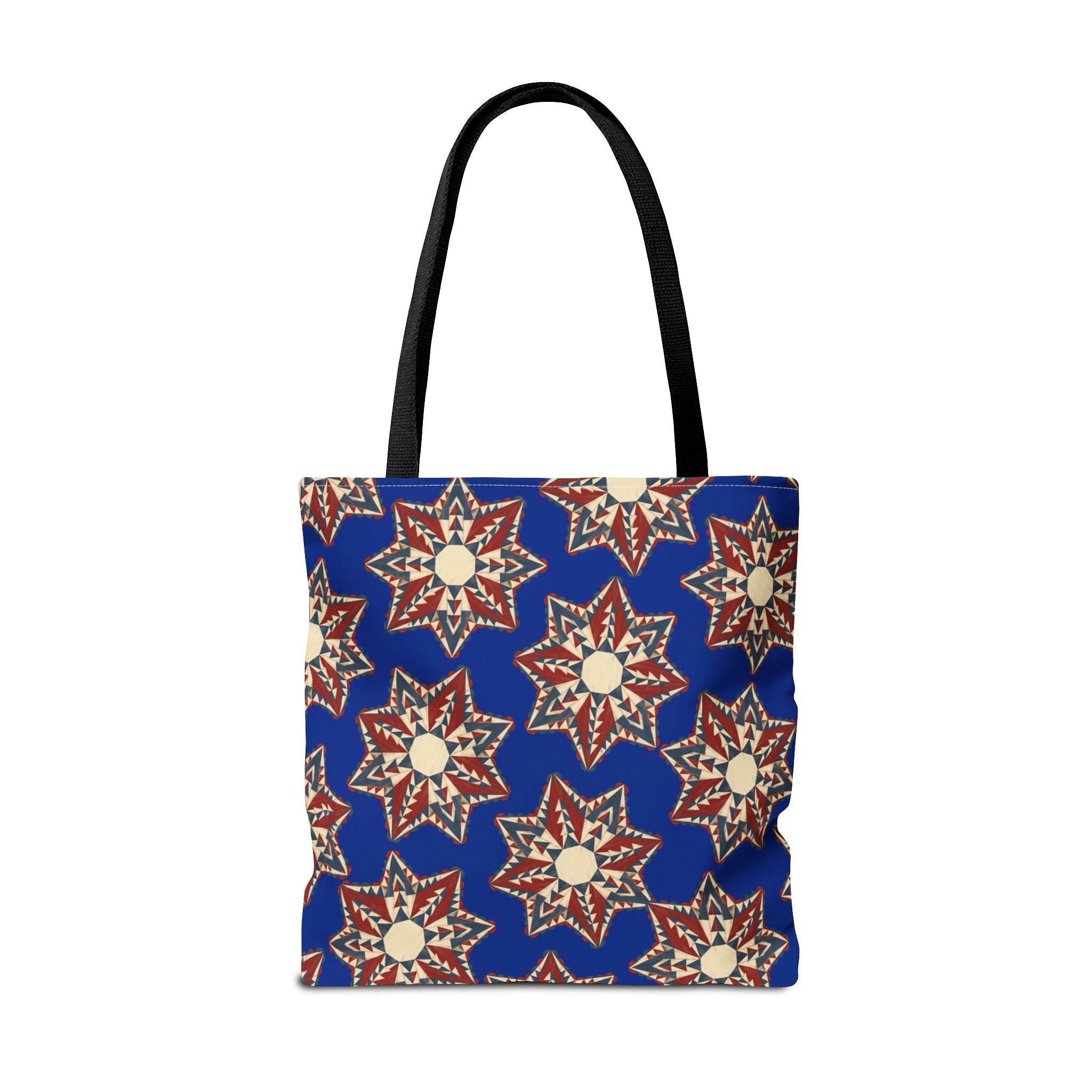 Blue tote bag with starburst floral pattern and black handles