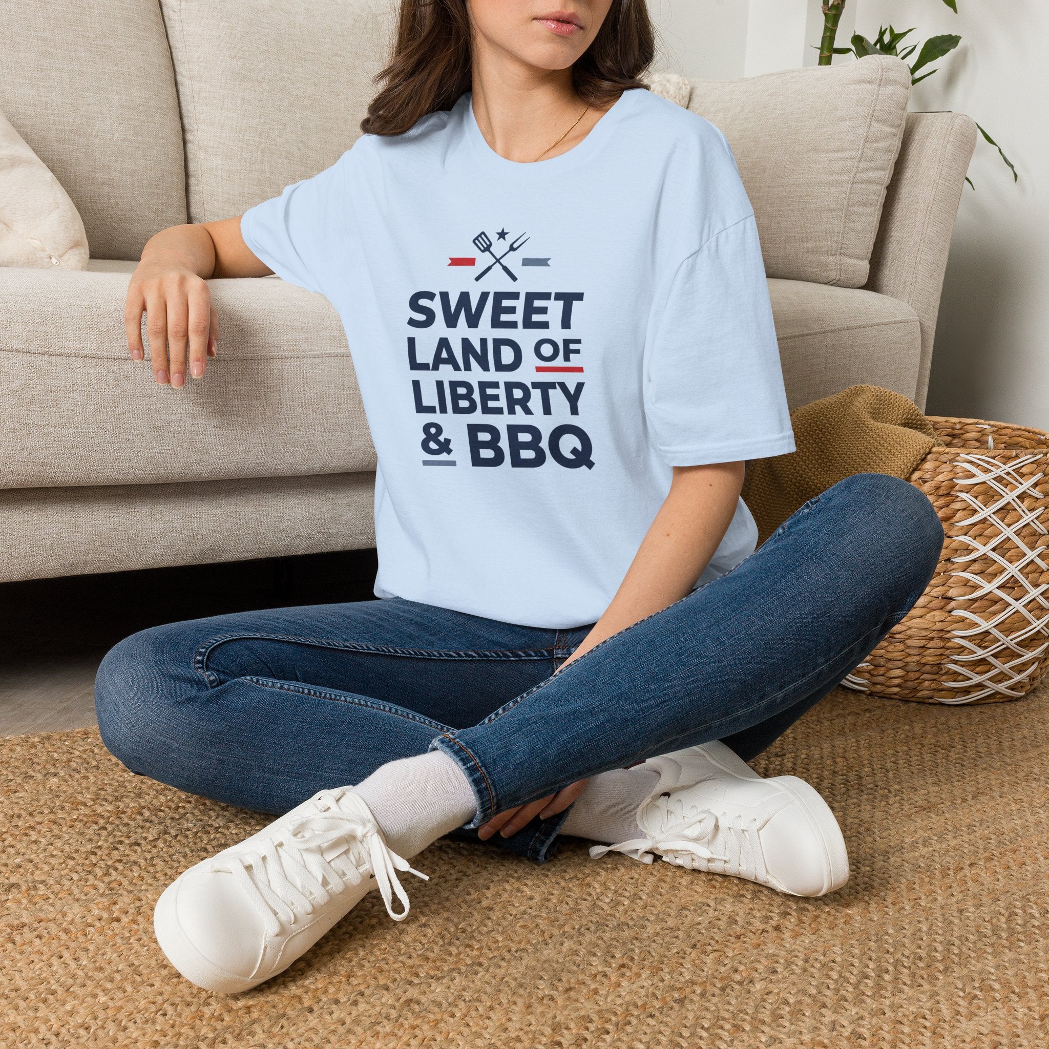 Light blue T-shirt with “Sweet Land of Liberty & BBQ” graphic on the front.