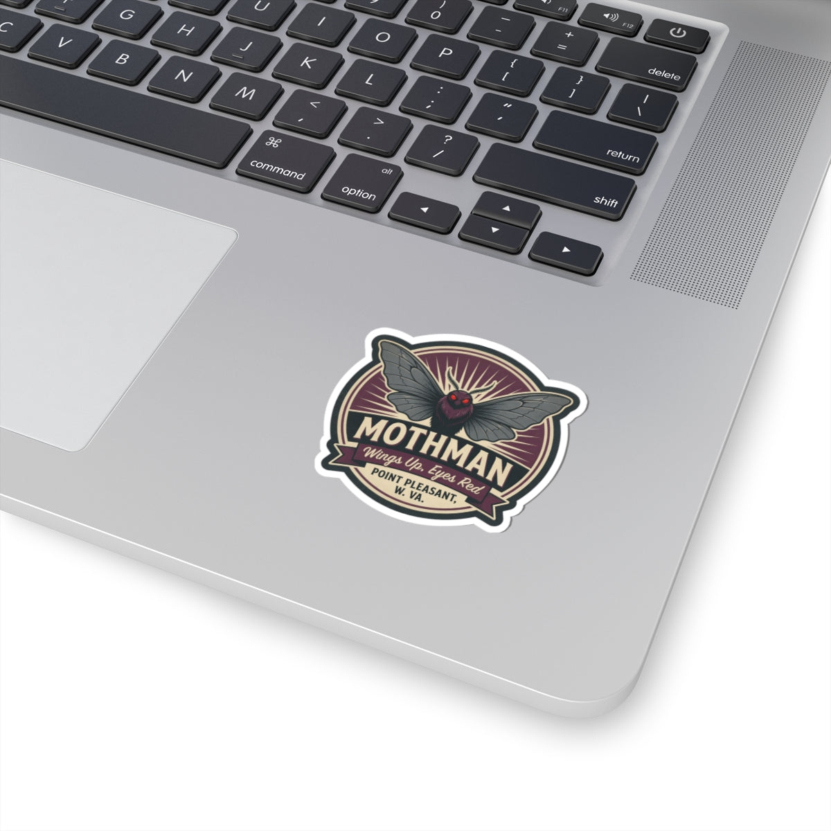 Kiss-cut Mothman emblem sticker with red eyes and wings, white border