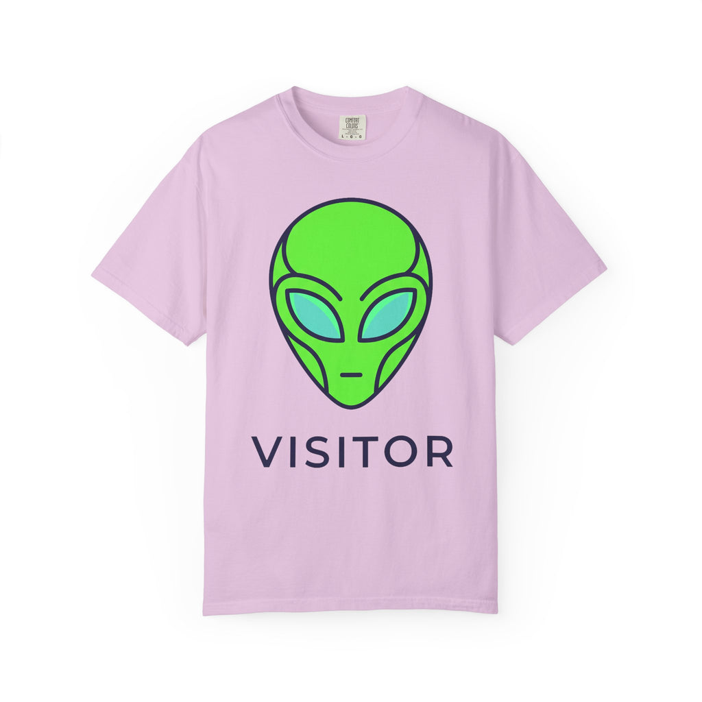 Alien visitor T-shirt in light pink with neon green alien face and “VISITOR” text