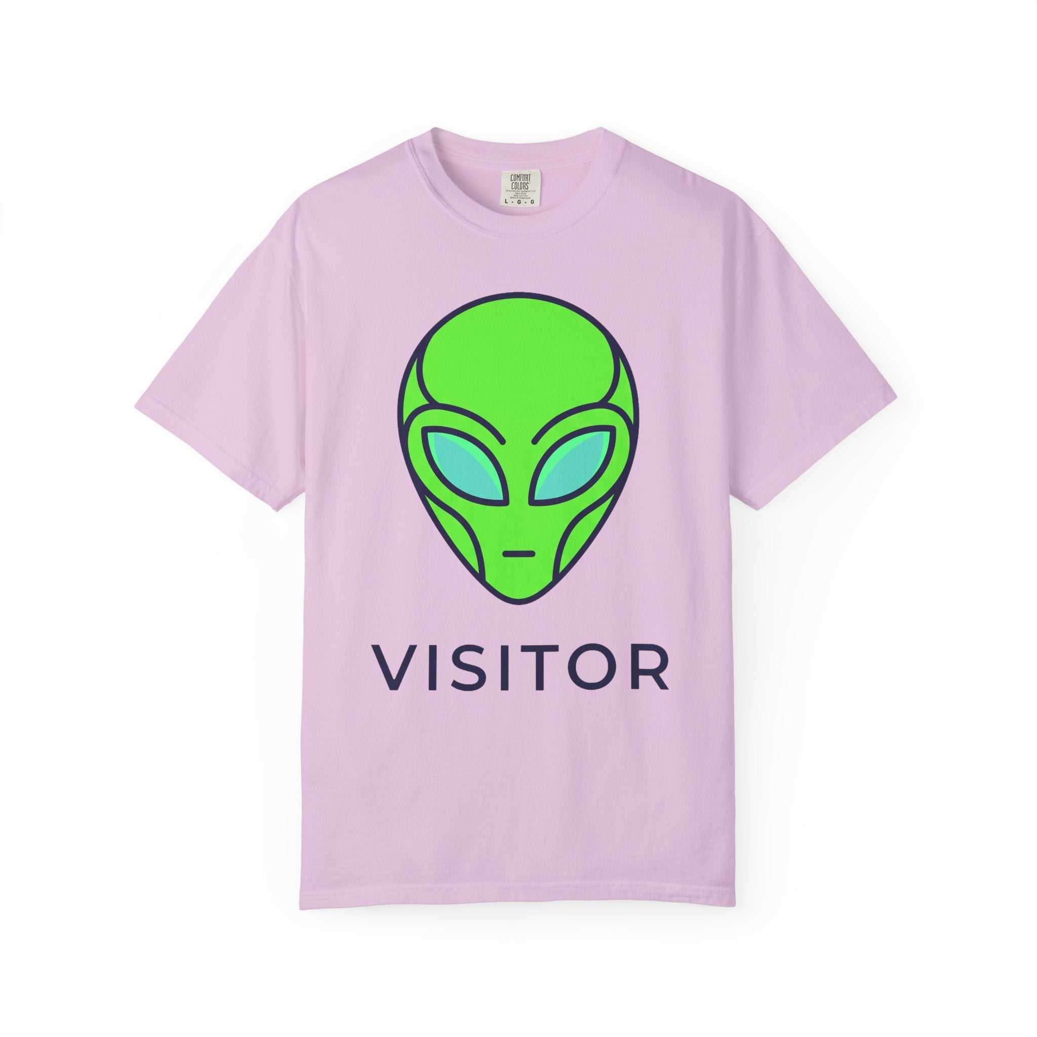 Alien visitor T-shirt in light pink with neon green alien face and “VISITOR” text