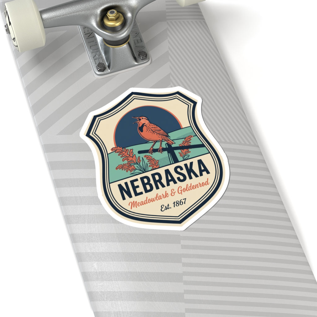 Nebraska vintage badge sticker on a gray surface, meadowlark & goldenrod, Est. 1867