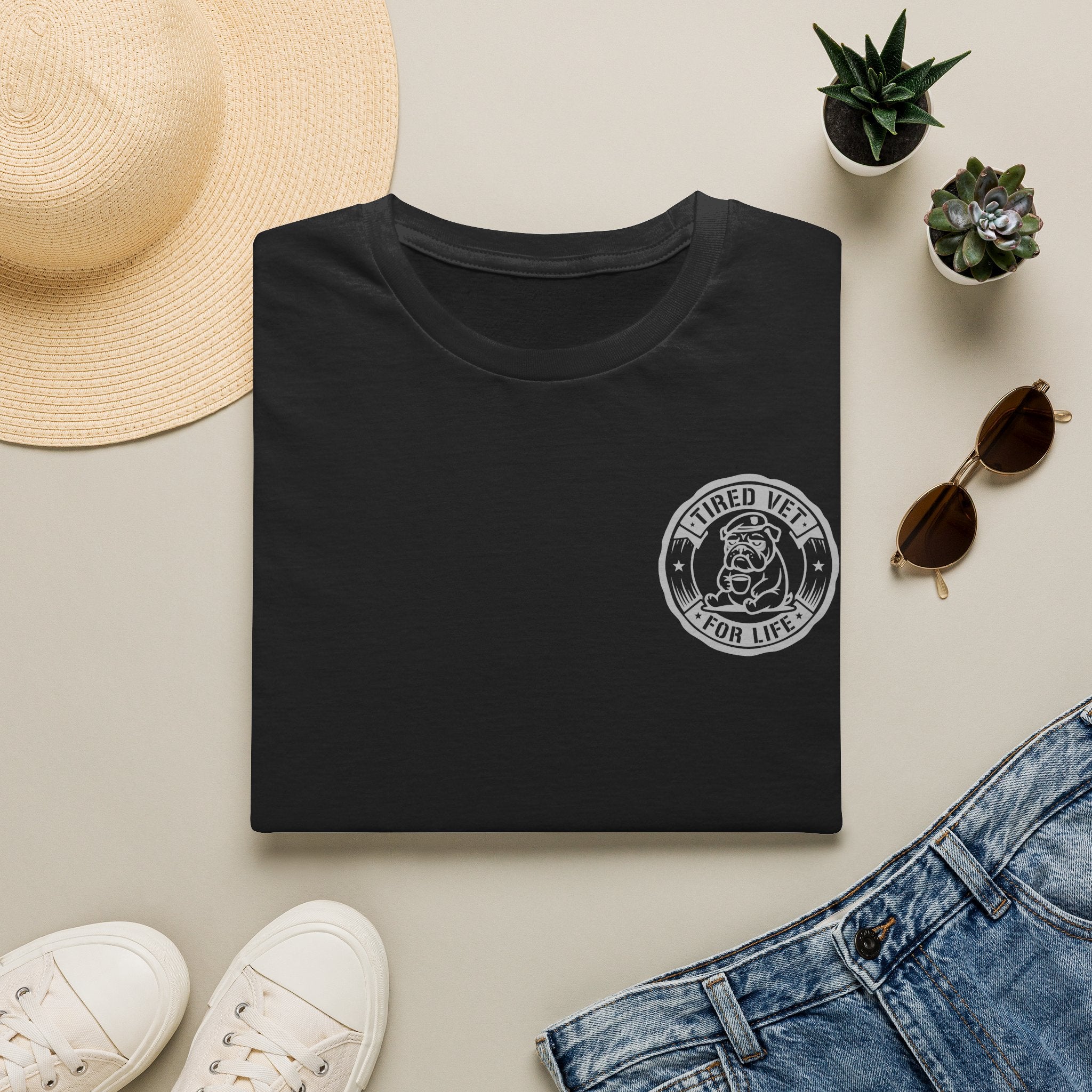 Dark heather crewneck T-shirt with circular retired veteran emblem on left chest