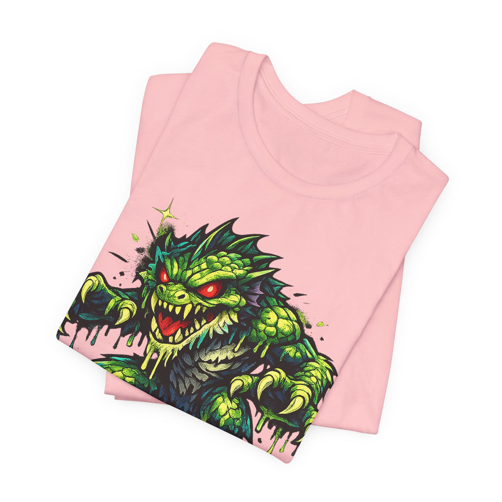 Pink T-shirt with green swamp monster graphic and red eyes on front