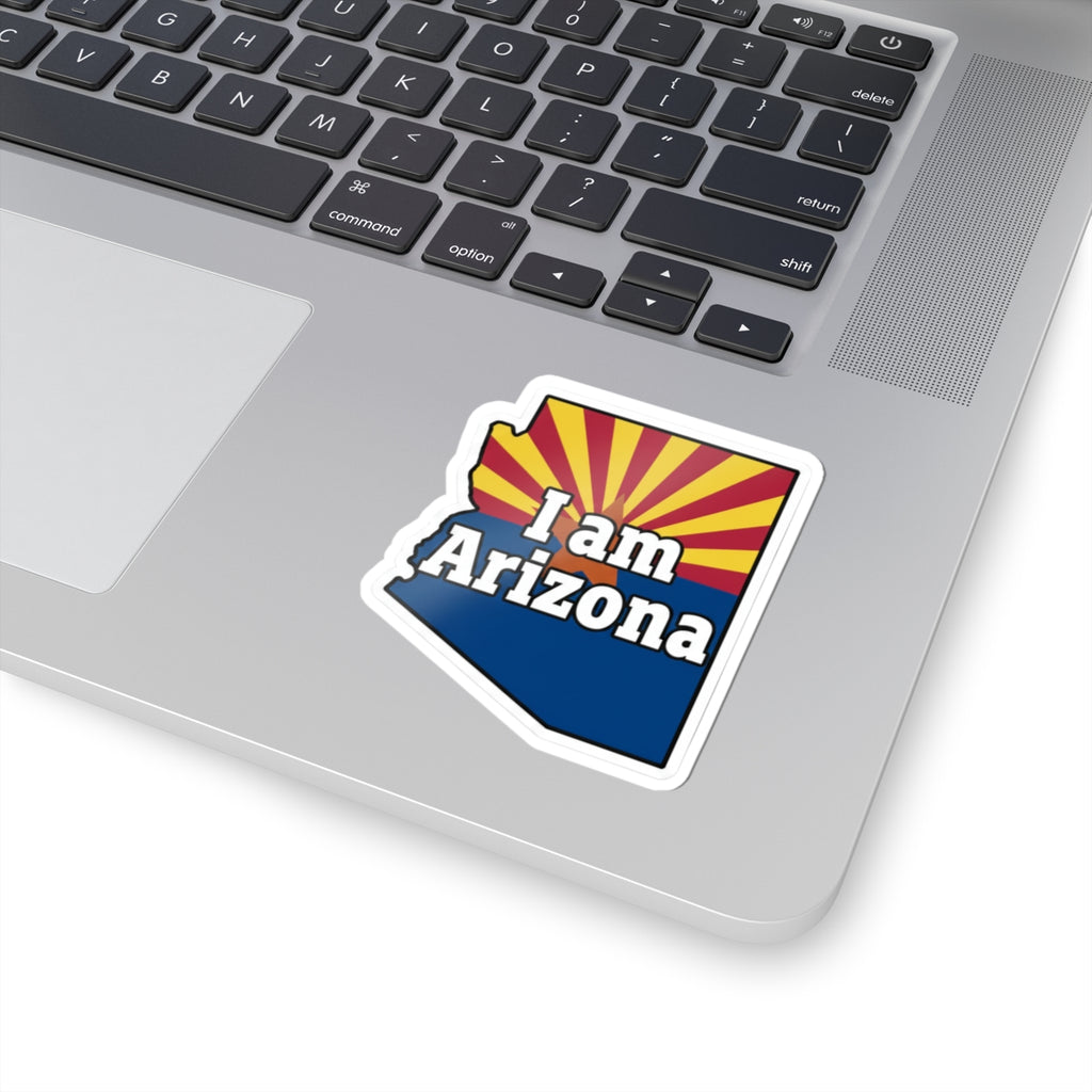 Sticker decal on laptop keyboard: 'I am Arizona' with patriotic AZ flag design