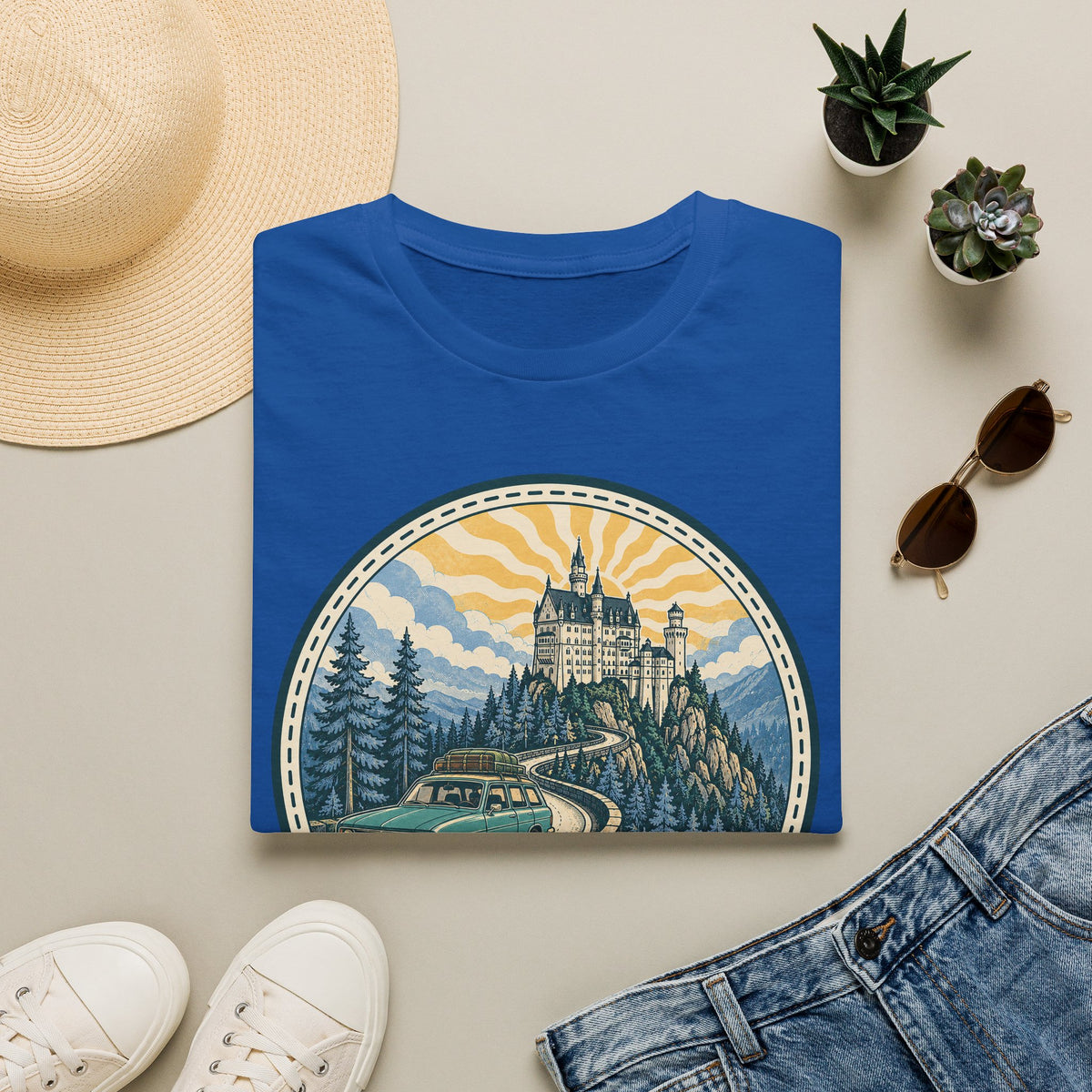 Royal blue T-shirt with circular castle landscape illustration graphic