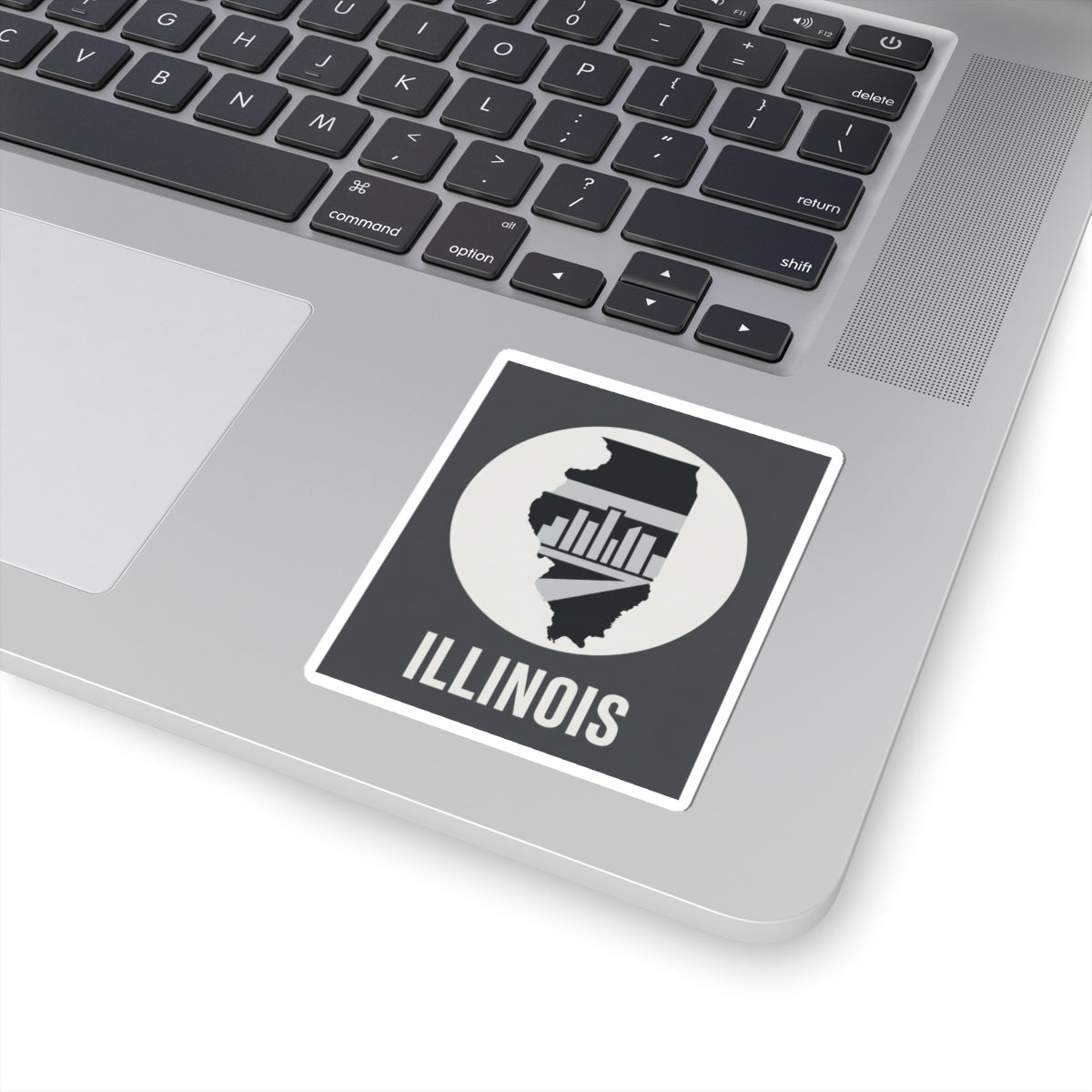 Illinois skyline state sticker on a laptop lid, with “ILLINOIS” text