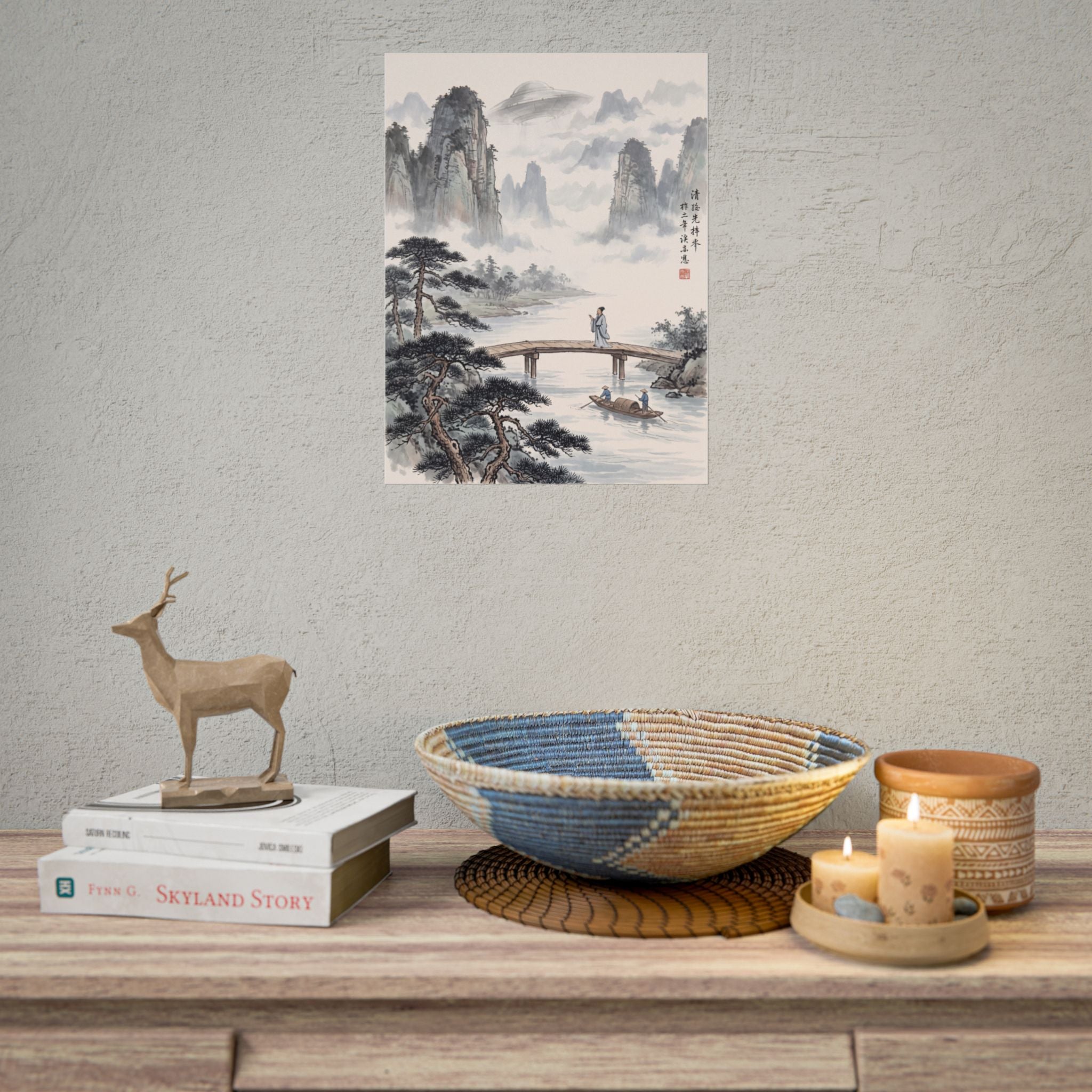 Landscape rolled poster on wall with mountain peaks, clouds, river, and bridge scene.