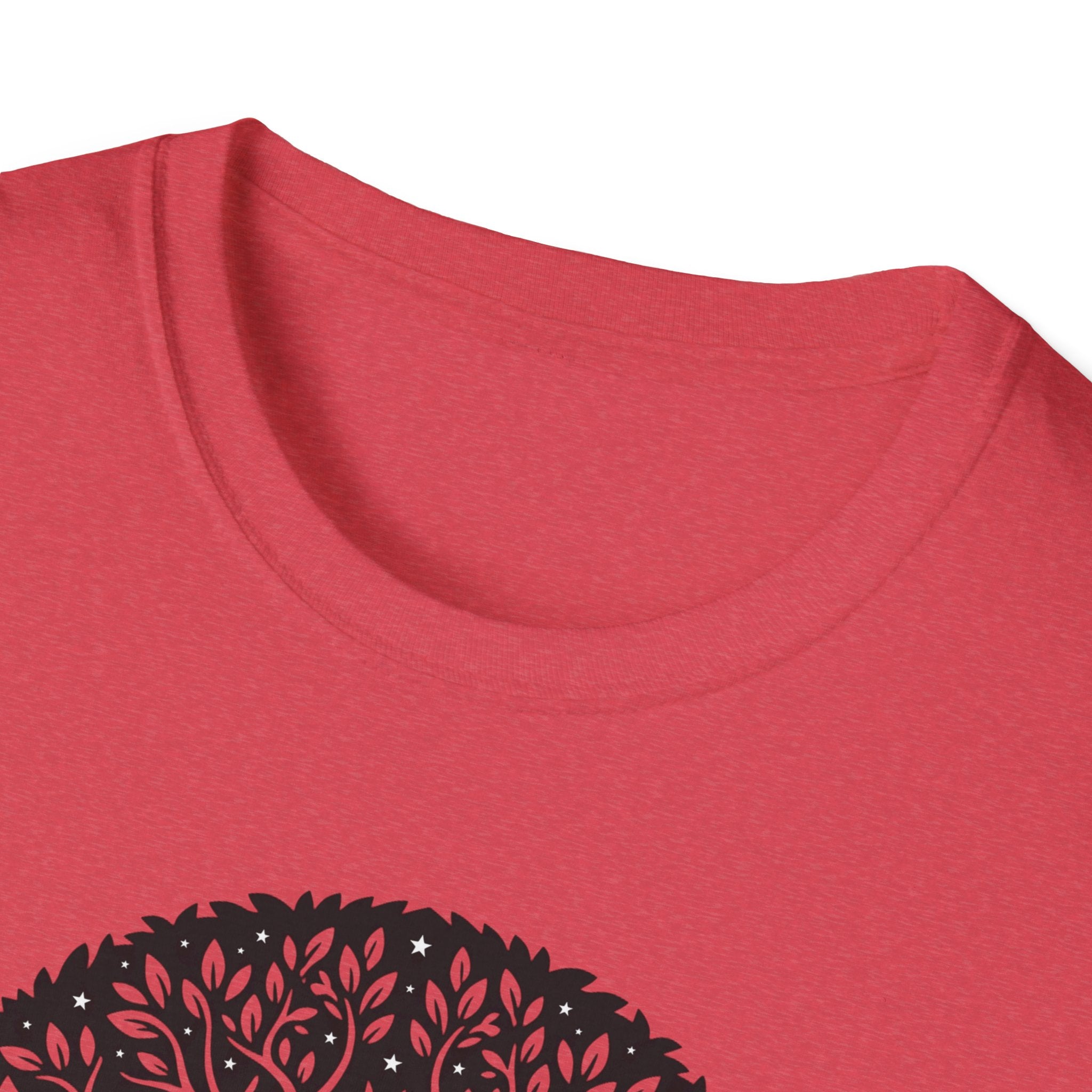 Red t-shirt neckline close-up with partial Tree of Life botanical graphic
