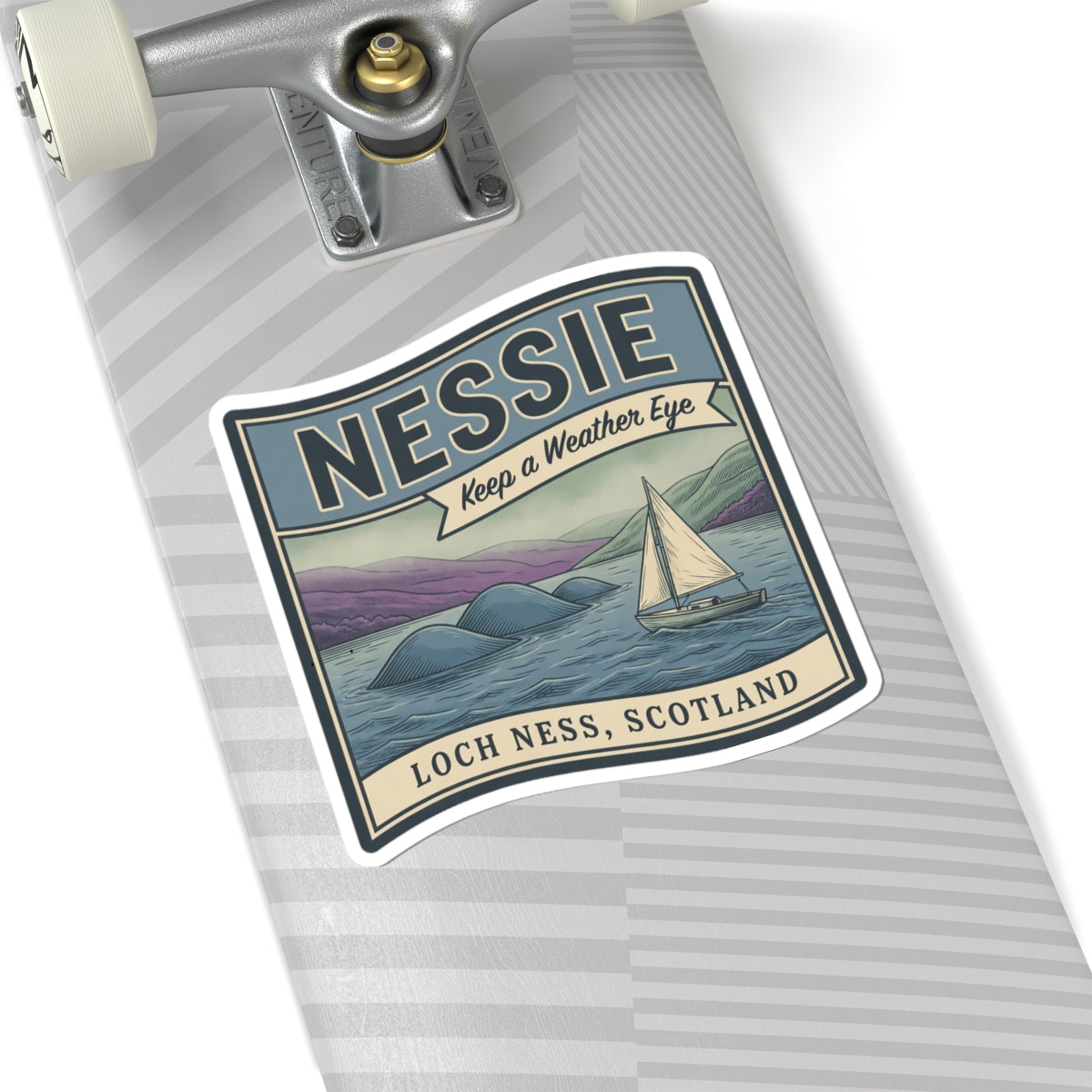 Loch Ness Scotland sticker on a striped tag with Nessie, sailboat, and vintage text
