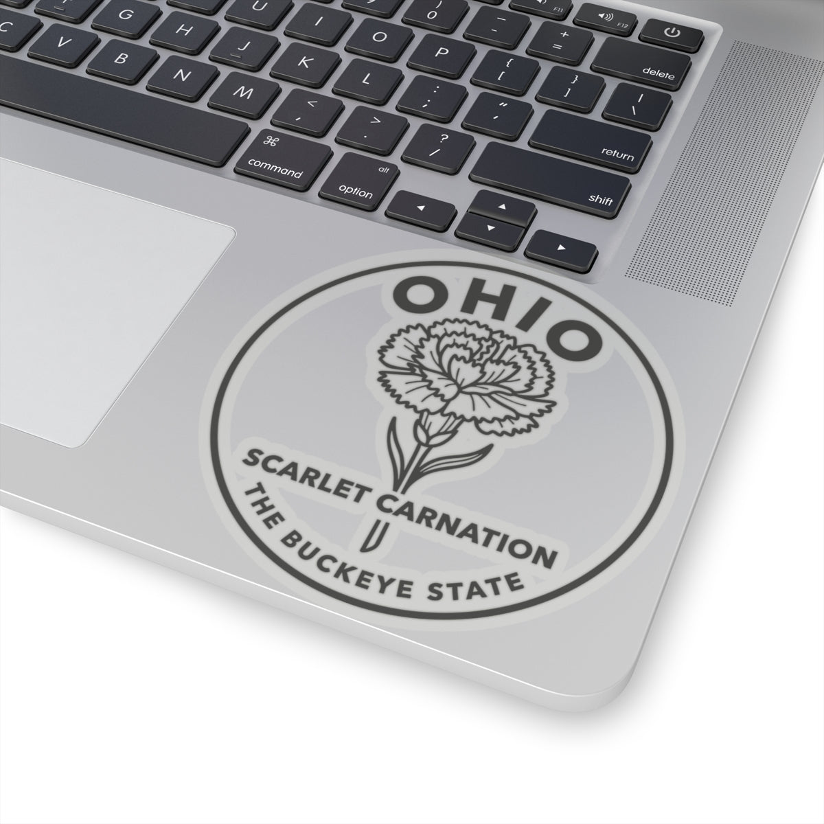 Round Ohio scarlet carnation decal on laptop lid, centered and clear