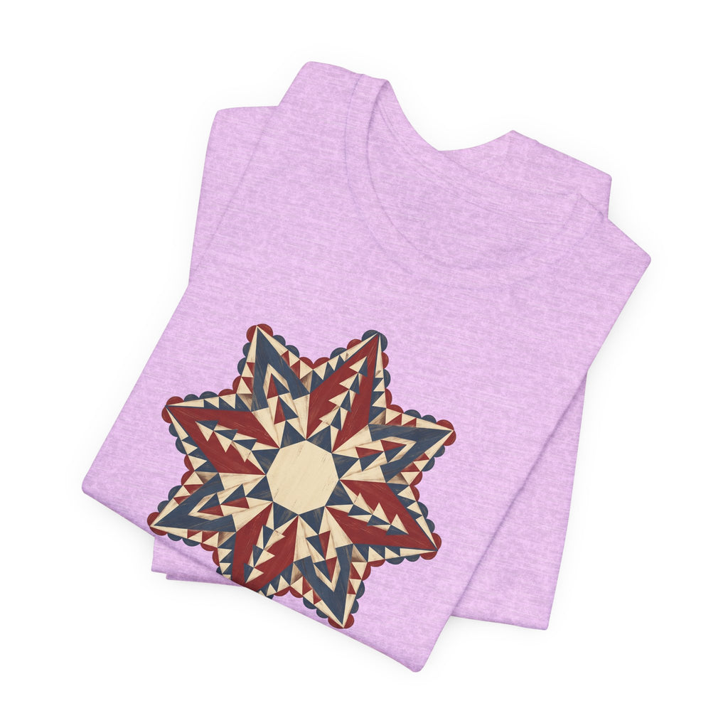 Lavender graphic T-shirt with large star mandala print in red, cream, and tan triangles