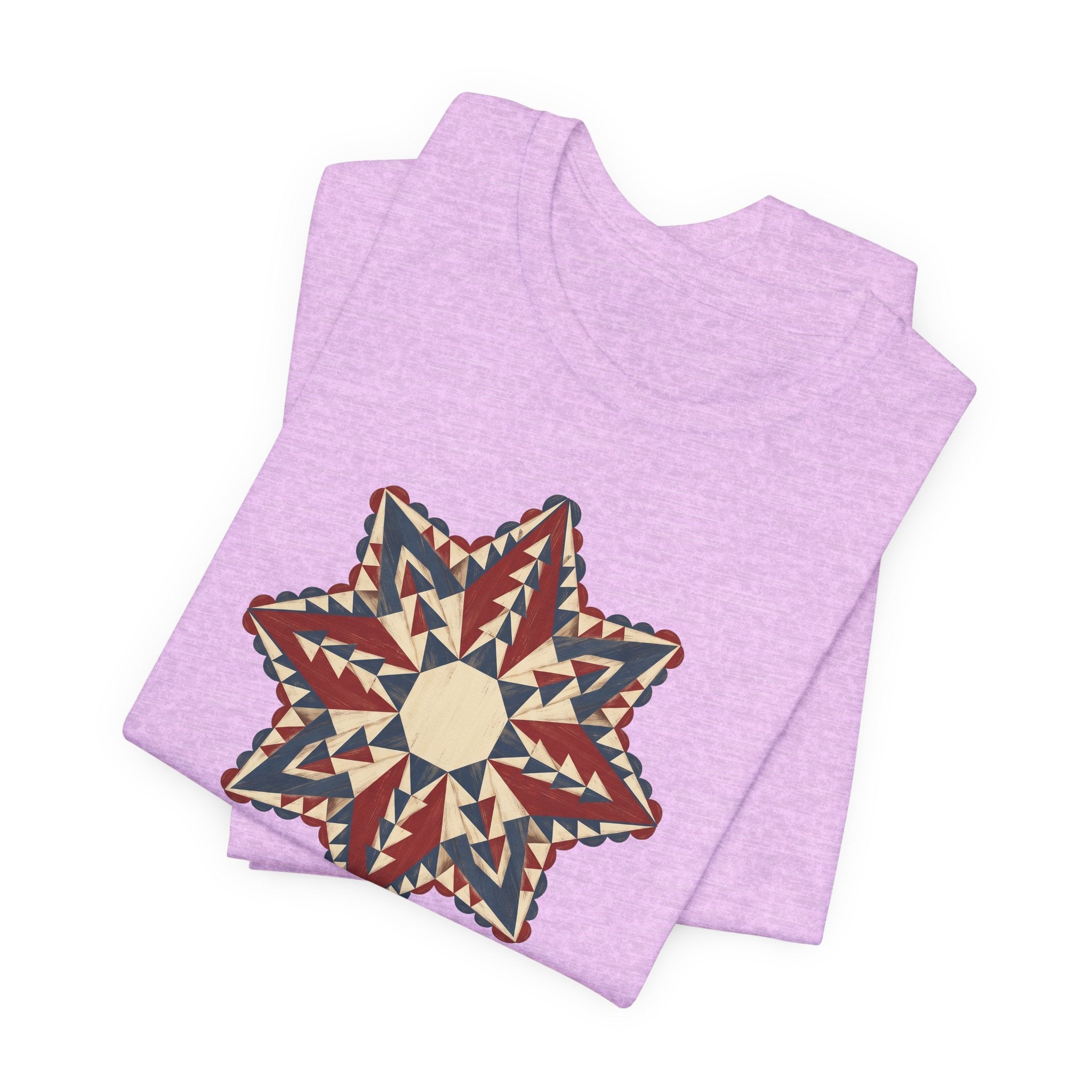 Lavender graphic T-shirt with large star mandala print in red, cream, and tan triangles