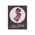 Square metal wall art with mauve New Jersey silhouette and “New Jersey” script