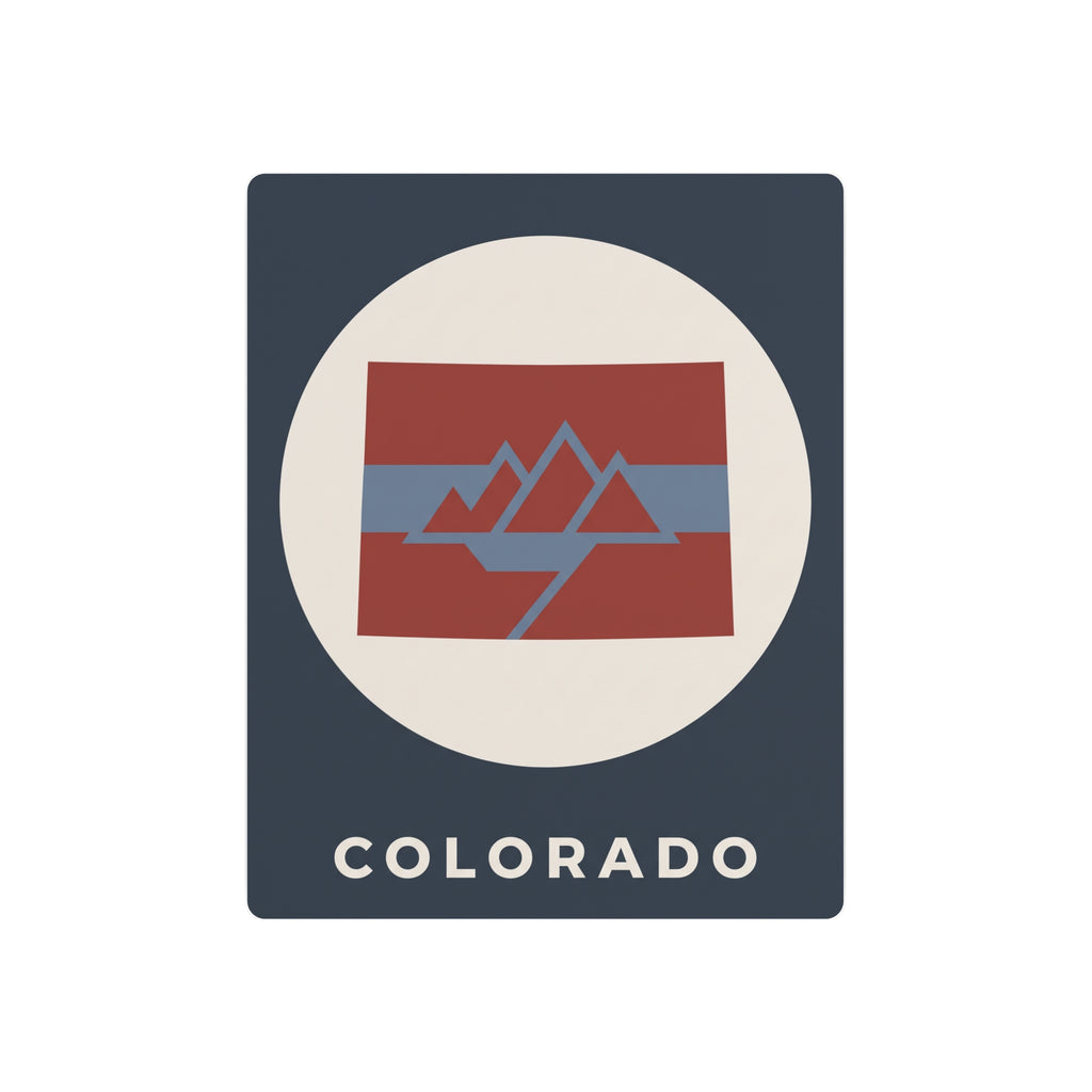Colorado metal art sign with circular mountain flag graphic and “COLORADO” text