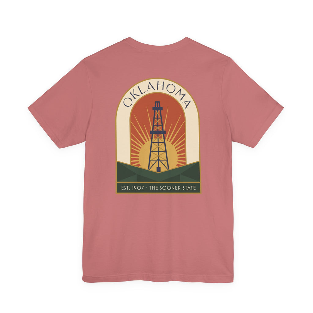 Dusty rose T-shirt with large back oil derrick sunset graphic and Oklahoma text